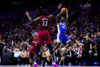 Philadelphia 76ers' Shake Milton (18) goes up for a shot against Miami Heat's Bam Adebayo during the second half of Game 6 of an NBA basketball second-round playoff series, Thursday, May 12, 2022, in Philadelphia. (AP Photo/Matt Slocum)