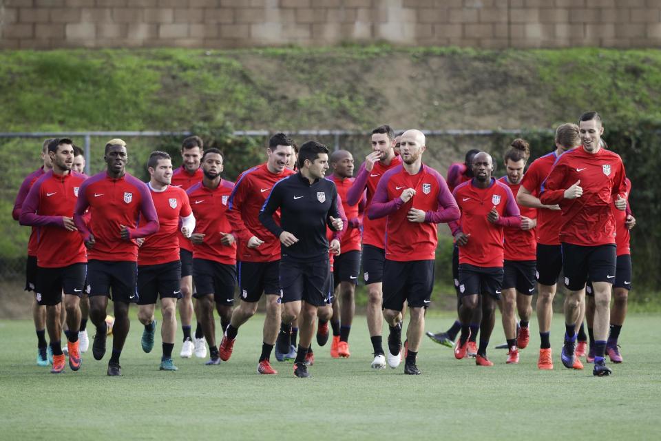 Members of the U.S. men's national soccer team warm up during practice Wednesday, Jan. 11, 2017, in Carson, Calif. Coach Bruce Arena opens camp with the team in the same training complex where he spent the past eight years running the LA Galaxy. Arena returned to the U.S. team in November to salvage its run for World Cup qualification. (AP Photo/Jae C. Hong)