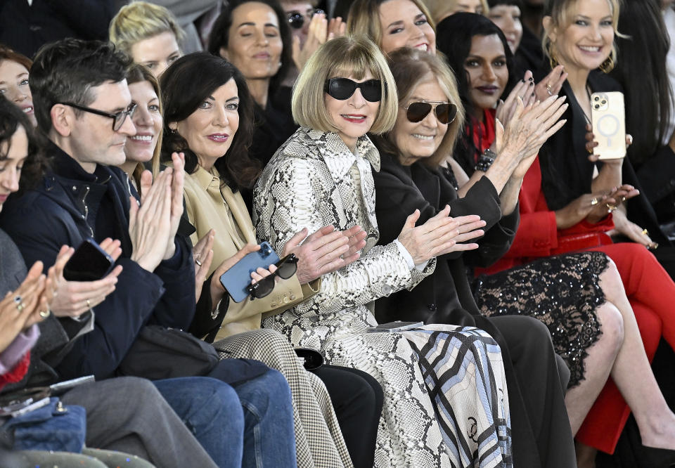 New York Gov. Kathy Hochul, fourth from left, Anna Wintour, Gloria Steinem, Kate Hudson, right, and Mindy Kaling, second right, attend the Michael Kors Fall/Winter 2023 fashion show on Wednesday, Feb. 15, 2023, in New York. (Photo by Evan Agostini/Invision/AP)