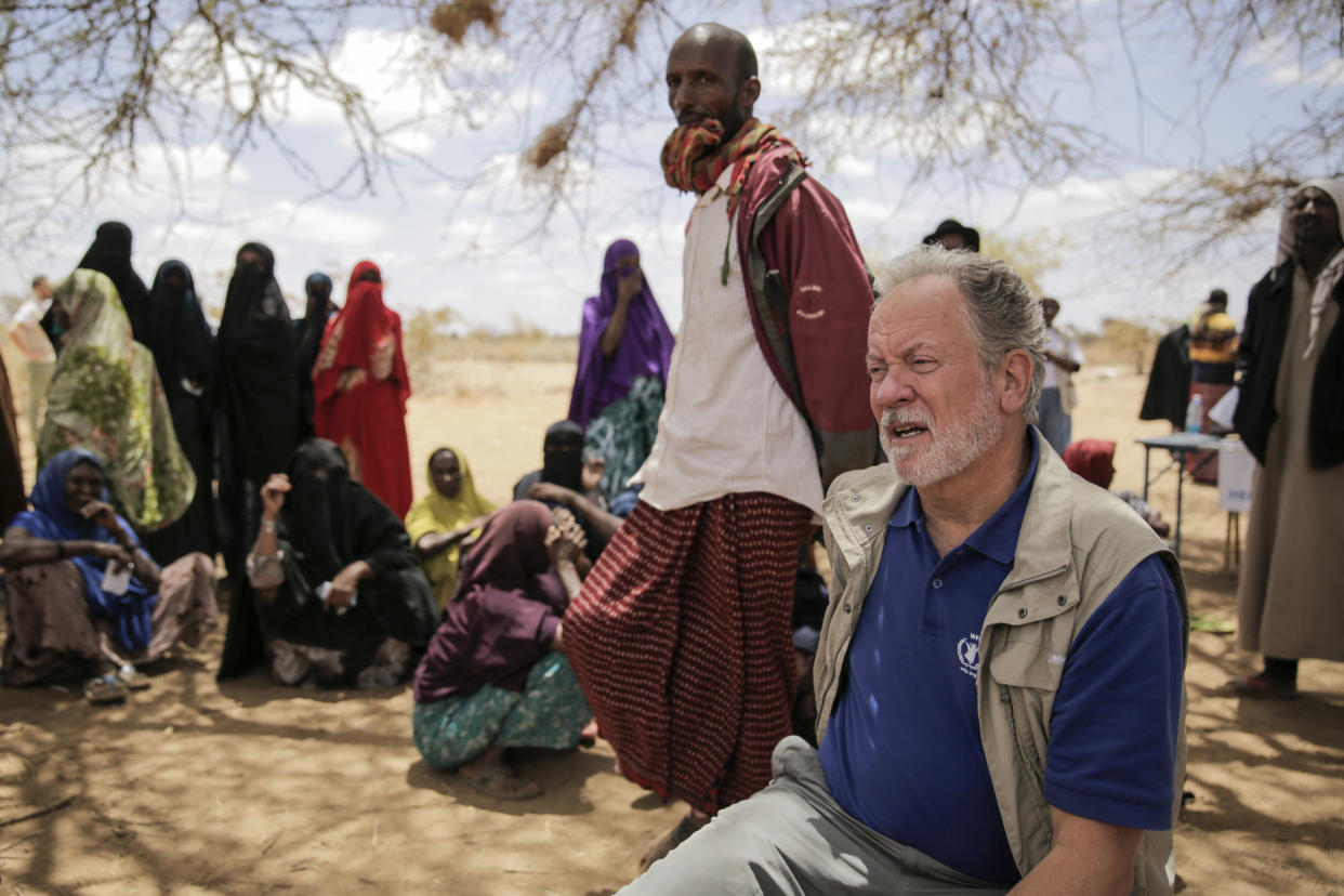 FILE - World Food Program chief David Beasley meets with villagers in the village of Wagalla in northern Kenya, Aug. 19, 2022. Beasley is warning that without billions of dollars more to feed millions of hungry people, the world will see mass migration, destabilized countries, and starving children and adults in the next 12 to 18 months. (AP Photo/Brian Inganga, File)