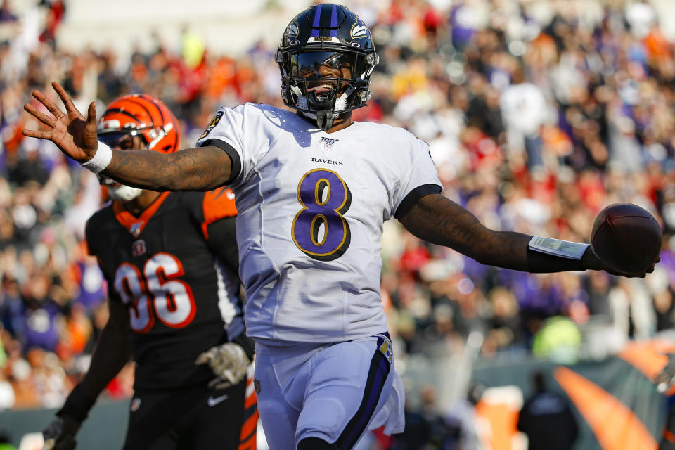 All hail: Baltimore Ravens coach John Harbaugh told quarterback Lamar Jackson that he's changing the game. (AP/Frank Victores)