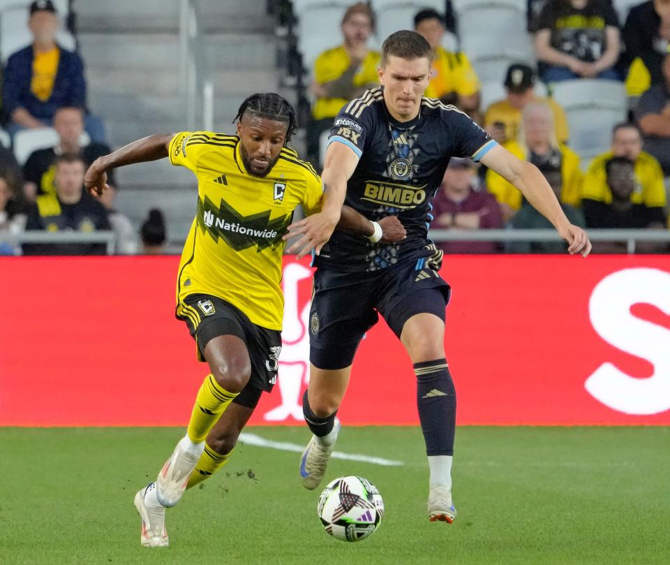 August 21, 2024; Columbus, Ohio, USA; 
Columbus Crew defender Steven Moreira (31) is defended by Philadelphia Union forward Mikael Uhre (7) during the first half of a semifinal Leagues Cup match at Lower.com Field on Wednesday.