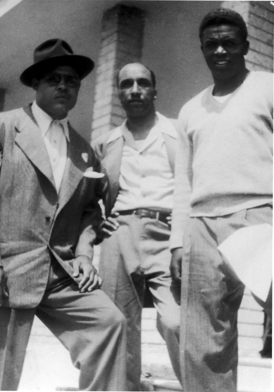 Joe Louis, left, with Sam Lacy, center, and Jackie Robinson.