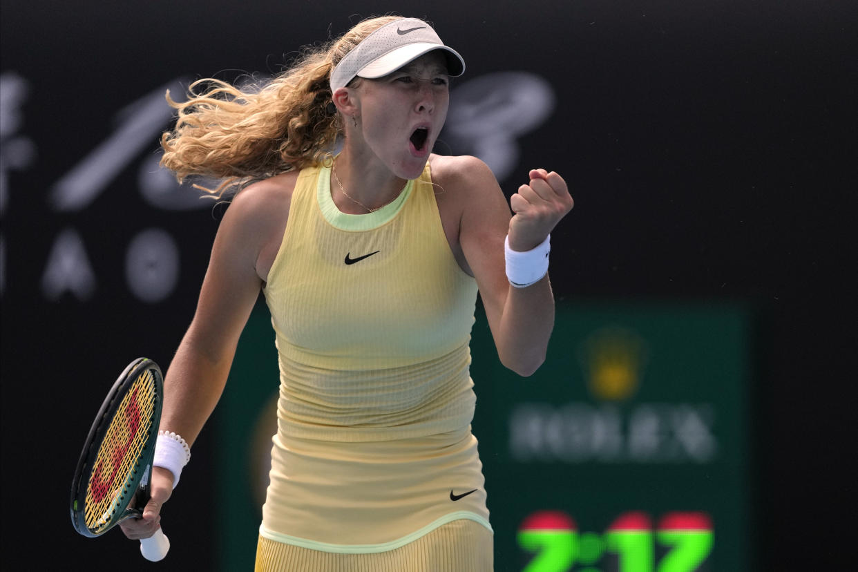 Mirra Andreeva of Russia reacts during her third round win over Diane Parry of France at the Australian Open tennis championships at Melbourne Park, Melbourne, Australia, Friday, Jan. 19, 2024. (AP Photo/Louise Delmotte)