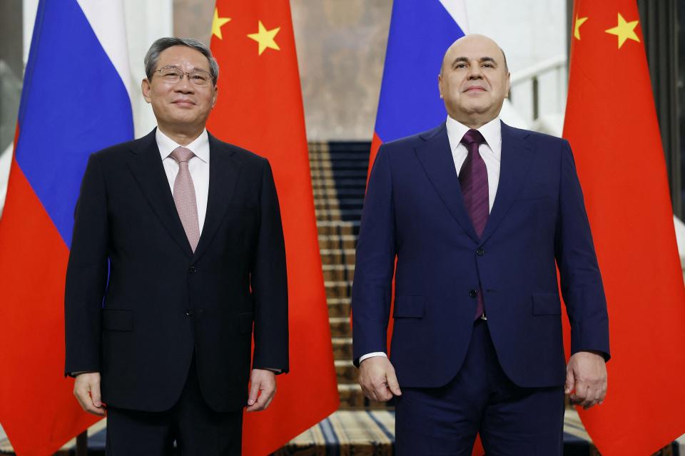 Russia's prime minister Mikhail Mishustin poses with Premier of the State Council of China Li Qiang (POOL/AFP via Getty Images)