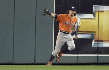 Oct 8, 2015; Kansas City, MO, USA; Houston Astros left fielder Colby Rasmus (28) celebrates after catching a fly ball against the Kansas City Royals to end game one of the ALDS at Kauffman Stadium. Denny Medley-USA TODAY Sports