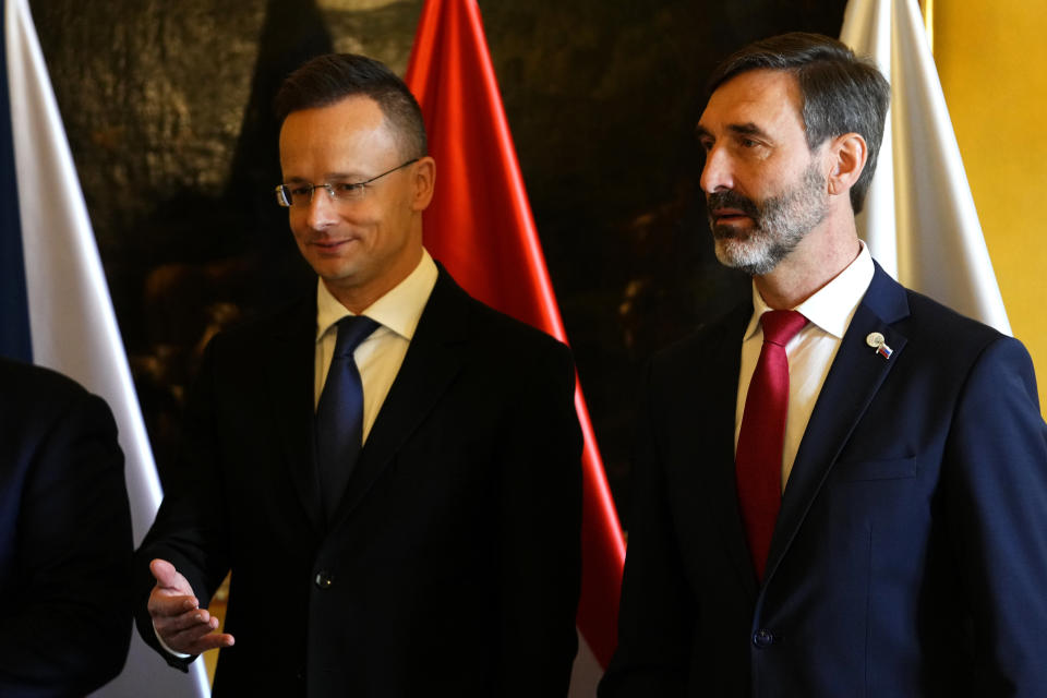 Slovakia's Foreign Minister Juraj Blanar, right, and his Hungarian counterpart Peter Szijjarto, right, attend a photo call as they meet in Prague, Czech Republic, Thursday, March 21, 2024. (AP Photo/Petr David Josek)