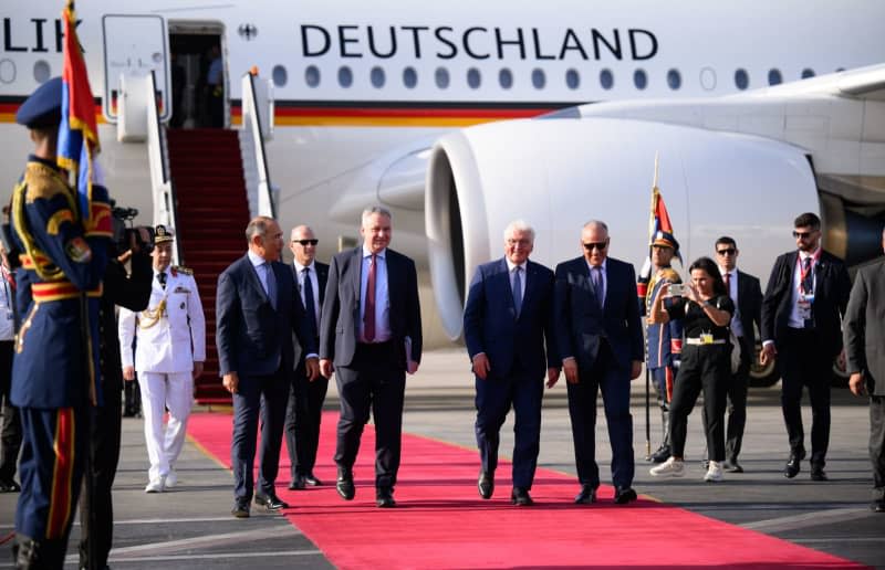 German President Frank-Walter Steinmeier (C) arrives at Cairo International Airport and is greeted by (L-R) Khaled Mohamed Galaleldin Abdelhamid, Egypt's Ambassador to Germany, Juergen Schulz, Germany's Ambassador to Egypt, and Hani Sewilam, Egypt's Minister of Water Resources and Irrigation. Bernd von Jutrczenka/dpa