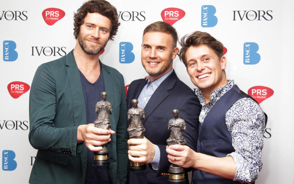 Gary with Howard Donald and Mark Owen - Getty Images