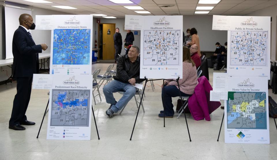 Maps displaying different district statistics for the 25-district map of Marion County are set up at a meeting about redistricting the districts, Friday, Jan. 28, 2022, at the Franklin Township Civic League in Indianapolis. 