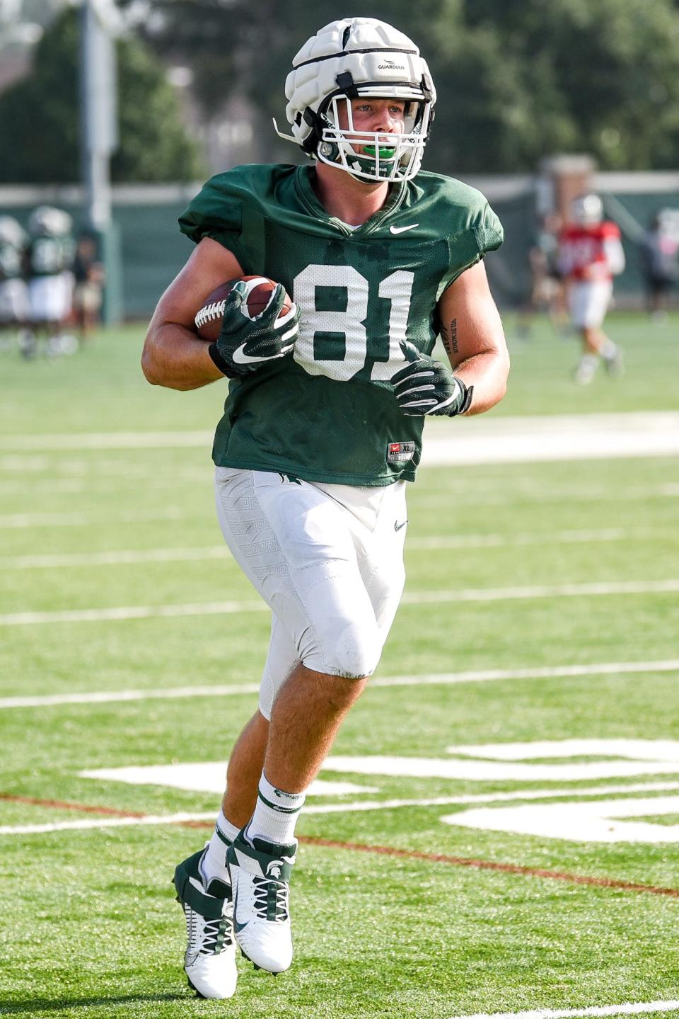 Michigan State's Parks Gissinger runs after a catch during football camp on Tuesday, Aug. 17, 2021, on the MSU campus in East Lansing.