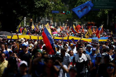 Demonstrators march during an opposition rally in Caracas, Venezuela April 6, 2017. REUTERS/Carlos Garcia Rawlins