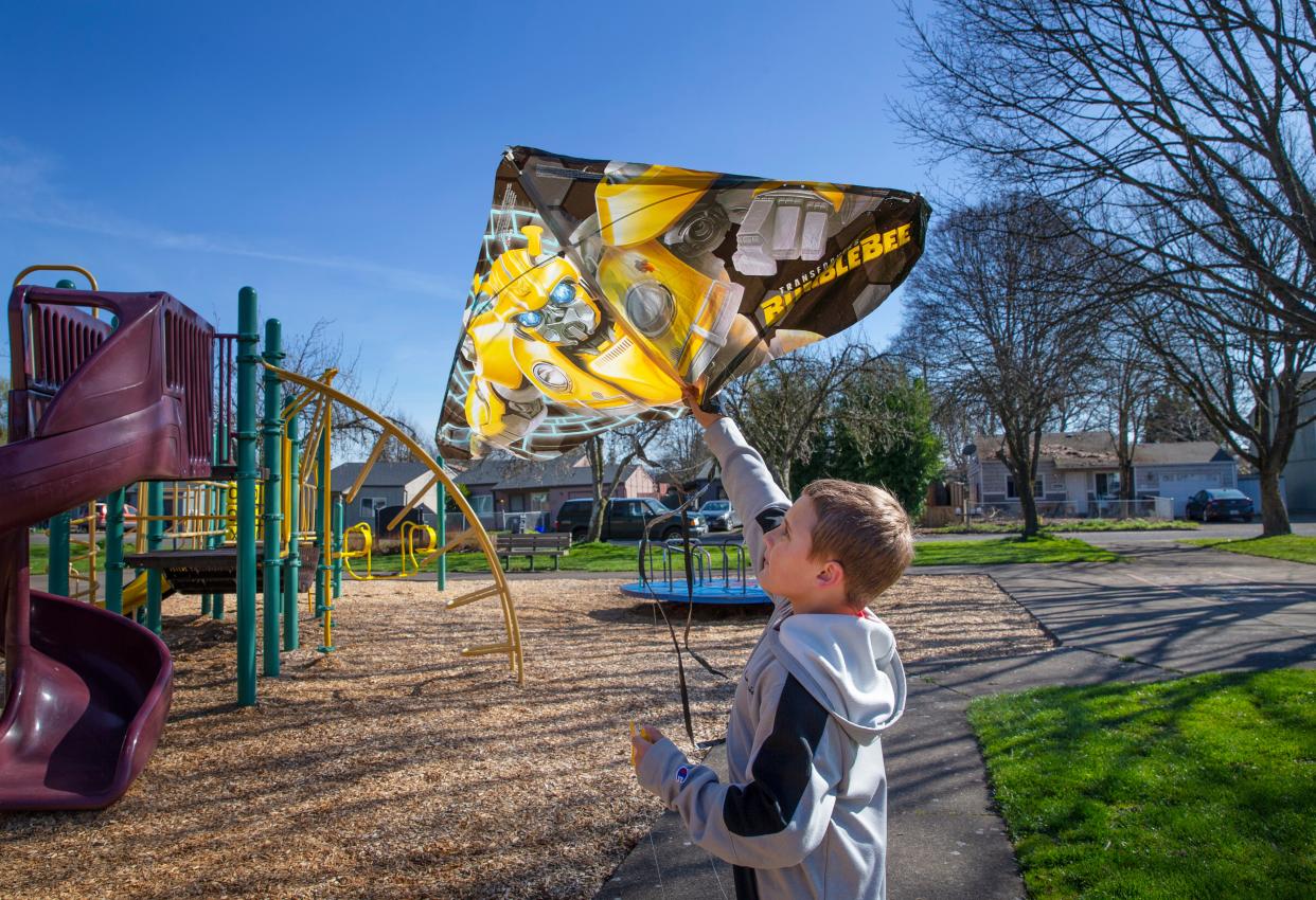 Seven-year-old John Kellum flies his kite in Trainsong Park in Eugene after it was partially reopened after work to remove contaminated soil. An investigation by DEQ found no link to dioxins found in soil samples and the Baxter Plant. 