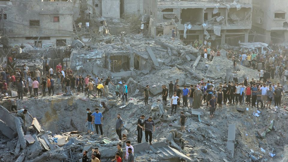 Palestinians search for casualties at the site of Israeli strikes in Jabalia refugee camp in the northern Gaza Strip, October 31, 2023. - Anas al-Shareef/Reuters