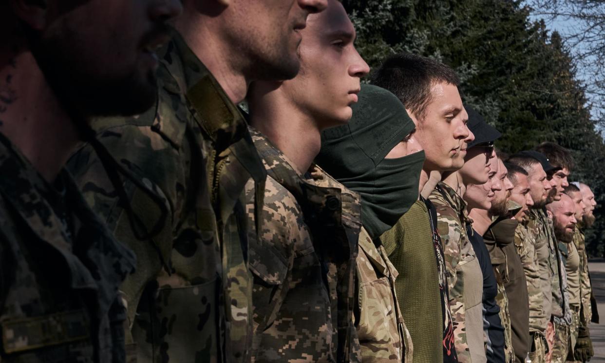 <span>Young recruits undergo military training in Kyiv.</span><span>Photograph: LIBKOS/Getty Images</span>