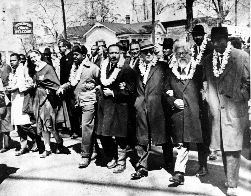 The Rev. Martin Luther King Jr. and other civil rights leaders march to the state capital in Montgomery, Ala., from Selma, Ala., on March 21, 1965. Accompanying King are, on his left, Ralph Bunche, undersecretary of the United Nations, Rabbi Abraham Joshua Heschel and the Rev. Fred Shuttlesworth. (Photo: AP)