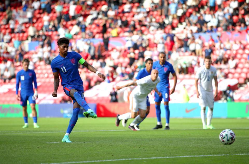 Marcus Rashford slots home from the penalty spot (PA Wire)