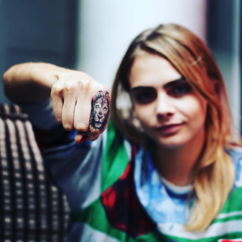 McCurdy is responsible for the lion on model Cara Delevingne’s index finger. BangBangNYC/ Instagram