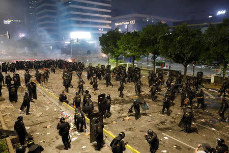 Riot police officers guard during a riot near the Election Supervisory Agency (Bawaslu) headquarters in Jakarta, Indonesia, May 22, 2019. REUTERS/Willy Kurniawan