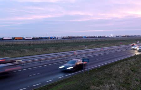 Lorries are seen queue at the Manston Airport waiting to do a test drive to the Port of Dover during a trial of how road will cope in case of a "no-deal" Brexit, Kent, Britain January 7, 2019. REUTERS/Toby Melville