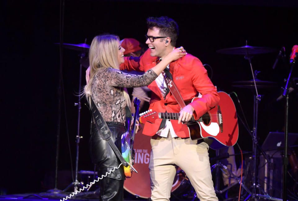 Lindsay and Bobby hugging on stage
