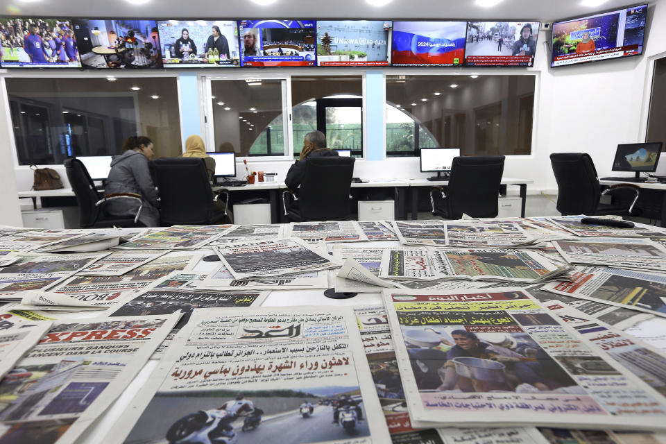 Newspapers rest on a table at a private television broadcaster in Algiers, Tuesday, March 19, 2024. Algerian officials are chiding television stations over the content choices they've made during Ramadan. Their criticisms come amid broader struggles facing journalists and broadcasters, which have historically relied heavily on advertising from the state and Sonatrach, its largest oil and gas company. (AP Photo/Anis Belghoul)