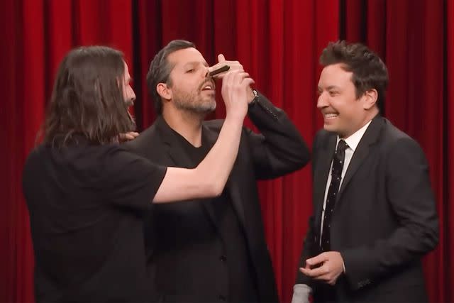 <p>NBC</p> Keanu Reeves pulling a knife from David Blaine's nose