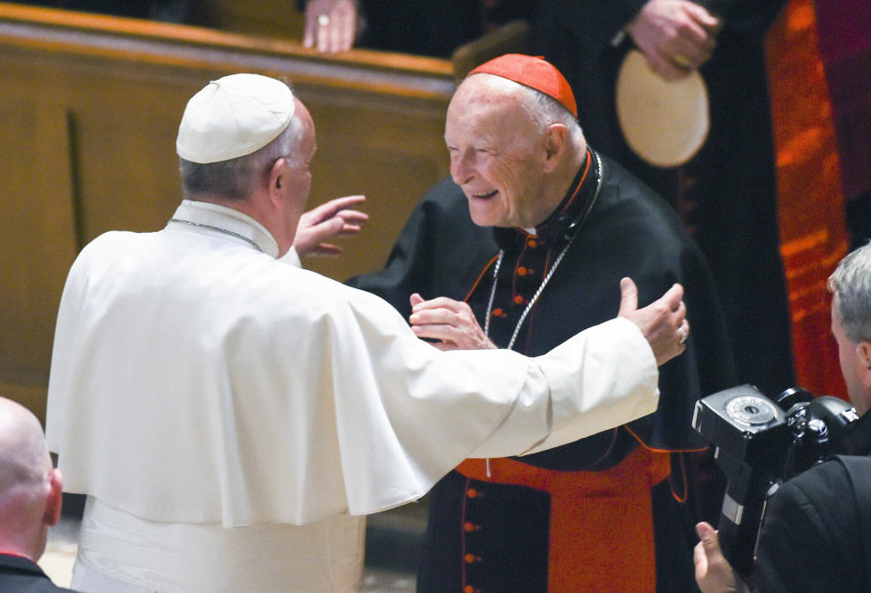 FILE - In this Sept. 23, 2015 file photo, Pope Francis reaches out to hug Cardinal Archbishop emeritus Theodore McCarrick after the Midday Prayer of the Divine with more than 300 U.S. Bishops at the Cathedral of St. Matthew the Apostle in Washington. Pope Francis has accepted U.S. prelate Theodore McCarrick's offer to resign from the College of Cardinals following allegations of sexual abuse, including one involving an 11-year-old boy, and ordered him to conduct a "life of prayer and penance" in a home to be designated by the pontiff until a church trial is held, the Vatican said Saturday. (Jonathan Newton/The Washington Post via AP, Pool, File)