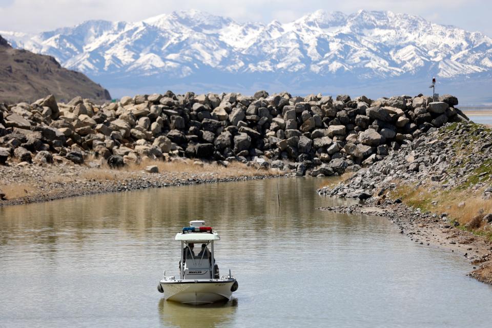 Division of Parks ranger Trent Currie and Steve Bullock, Division of Recreation law enforcement chief with the Utah Department of Natural Resources, approach the boat ramp in the Great Salt Lake State Park marina in Magna on Wednesday, April 19, 2023. | Kristin Murphy, Deseret News