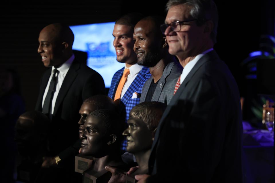 The Georgia-Florida Hall of Fame Class of 2022, inducted during a luncheon on Friday at the TIAA Bank Field East Club, are (from the left), Andre Caldwell, Trey Burton, Champ Bailey and John LIttle.