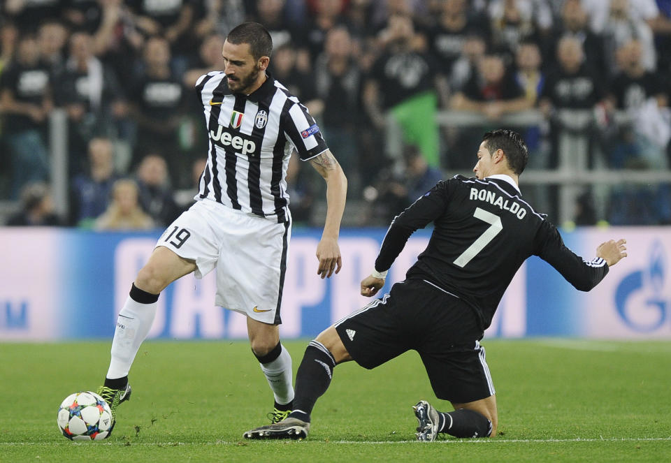 Juventus' Leonardo Bonucci in action with Real Madrid's Cristiano Ronaldo Reuters / Giorgio Perottino