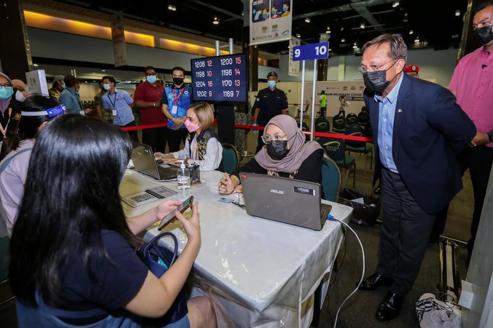 File picture shows Johor MB Datuk Hasni Mohammad inspecting the Johor ImmuPlan vaccination process during his visit to the PPV at the Persada Johor International Convention Centre in Johor Baru July 30, 2021. — Picture courtesy of Johor Mentri Besar’s Office