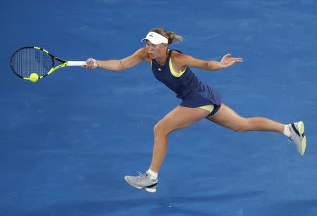 Tennis - Australian Open - Rod Laver Arena, Melbourne, Australia, January 19, 2018. Caroline Wozniacki of Denmark hits a shot against Kiki Bertens of the Netherlands. REUTERS/Edgar Su