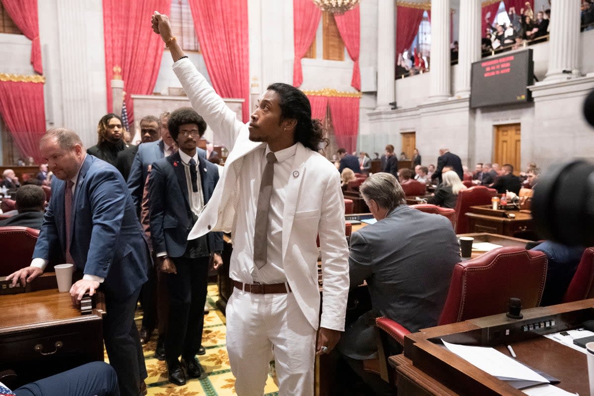 Rep Justin Jones raises his fist on the floor of the Tennessee House chamber after being expelled from the legislature on 6 April (Copyright 2023 The Associated Press. All rights reserved)