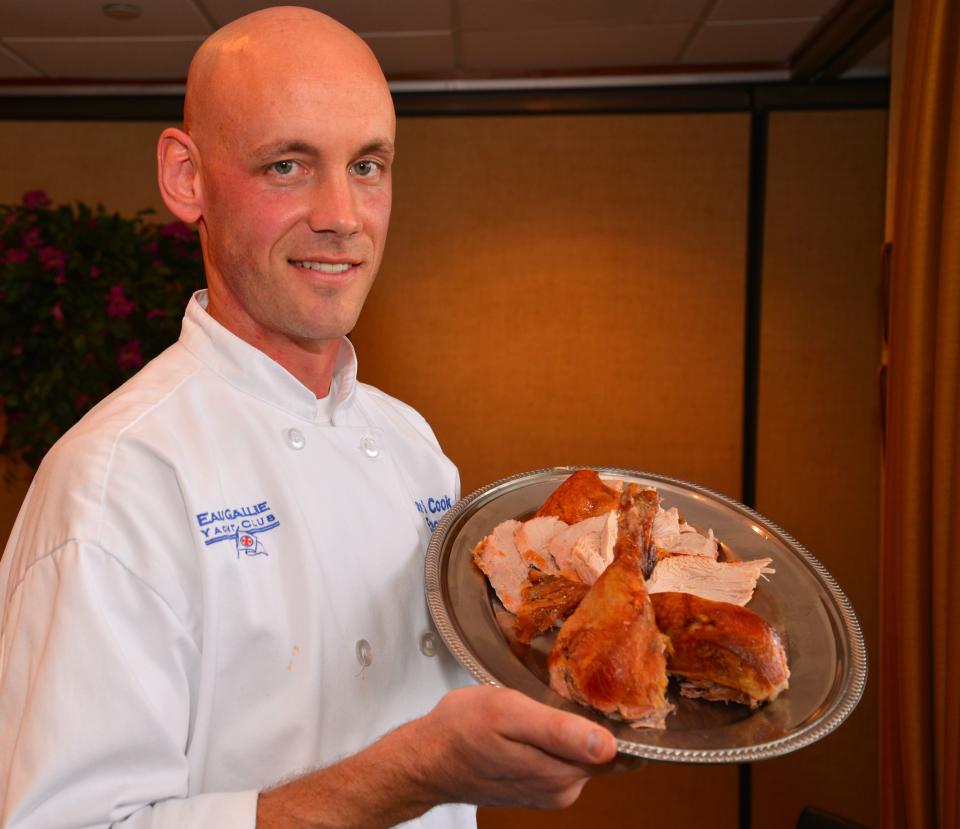 Lance Cook, CEC, CFBE, executive chef at the Eau Gallie Yacht Club, shows Suzy Leonard, Florida Today's food editor the correct way to carve a turkey. Chef Cook (what a great name for a chef) whowas car ving a 22 pound Holland turkey, shows a finished plate including white meat, dark meat and drumsticks.