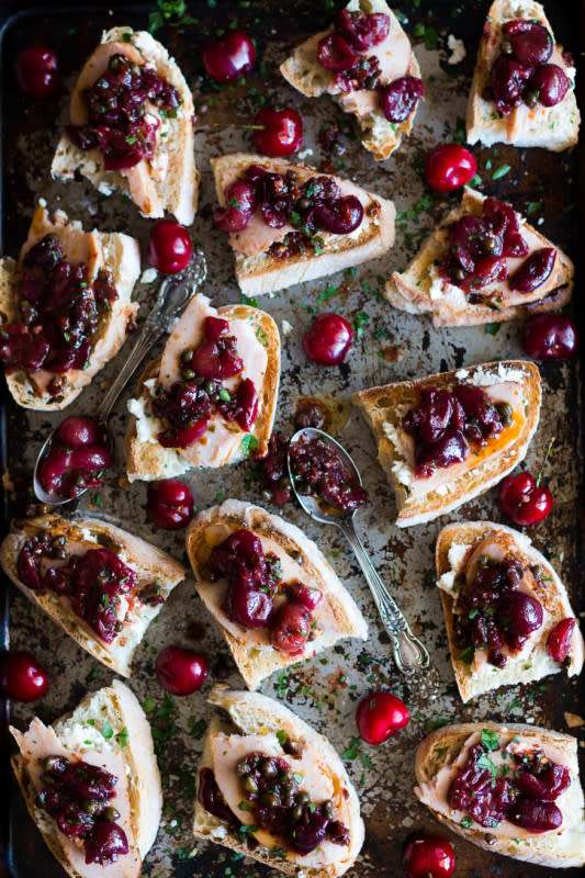 <p>Meg Is Well</p><p>A sweet and slightly tart appetizer that hits all the right taste buds.</p><p><strong>Get the recipe: <a href="https://megiswell.com/roasted-cherry-crostini-goat-cheese-smoked-turkey/" rel="nofollow noopener" target="_blank" data-ylk="slk:Roasted Cherry Crostini with Goat Cheese and Smoked Turkey;elm:context_link;itc:0;sec:content-canvas" class="link ">Roasted Cherry Crostini with Goat Cheese and Smoked Turkey</a></strong></p>
