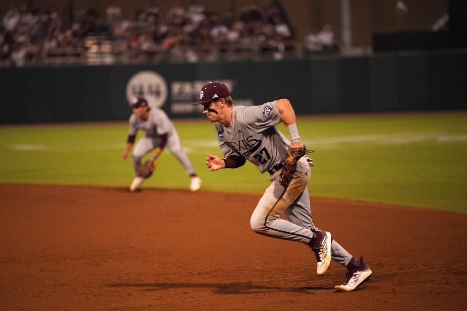 June 1, 2024; College Station, TX, USA; Texas A&M Aggies infielder Ted Burton (27) chases a ground ball during the second round in the NCAA baseball College Station Regional against the Texas Longhorns at Olsen Field College Station. Mandatory Credit: Dustin Safranek-USA TODAY Sports