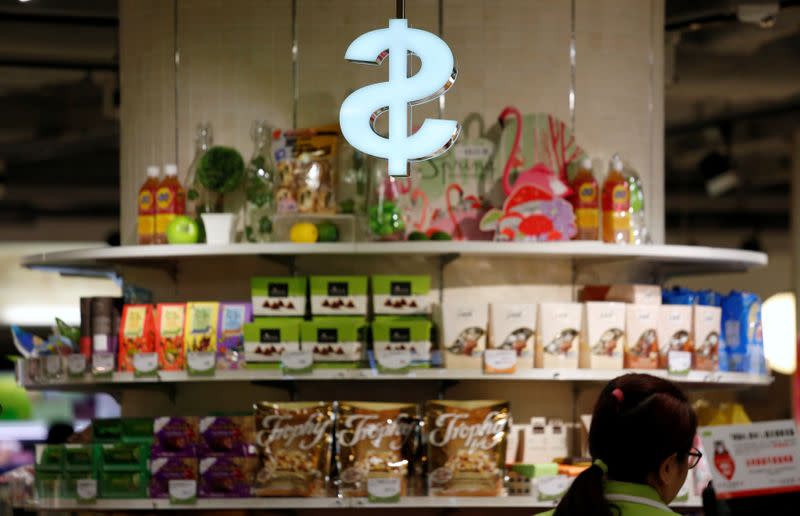 FILE PHOTO: Goods are displayed in front of a cashier at a supermarket in Hong Kong