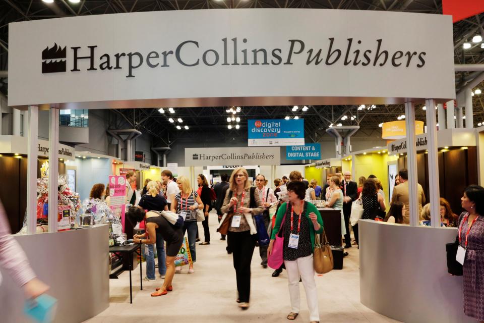 Attendees at BookExpo America visit the HarperCollins Publishers booth in New York on May 28, 2015. Some 250 copy editors, marketing assistants and other employees at HarperCollins Publishers went on strike in 2022 over wages and benefits, diversity policy and union protection.