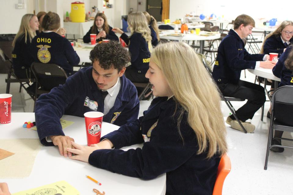 Ohio FFA President and OSU Student Luke Jennings used pom-poms to demonstrate prioritization skills to Zane Trace, Adena and Southeastern FFA students at Calvary Lutheran Church in Chillicothe, Ohio, on Oct. 2, 2023.