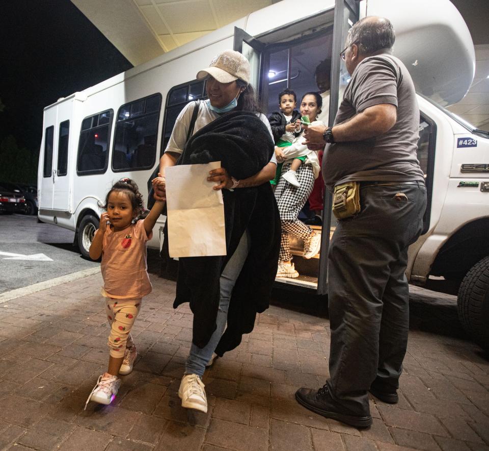 Families of asylum seekers are led into the Ramada hotel in Yonkers May 15, 2023. The families were being housed in New York City.
