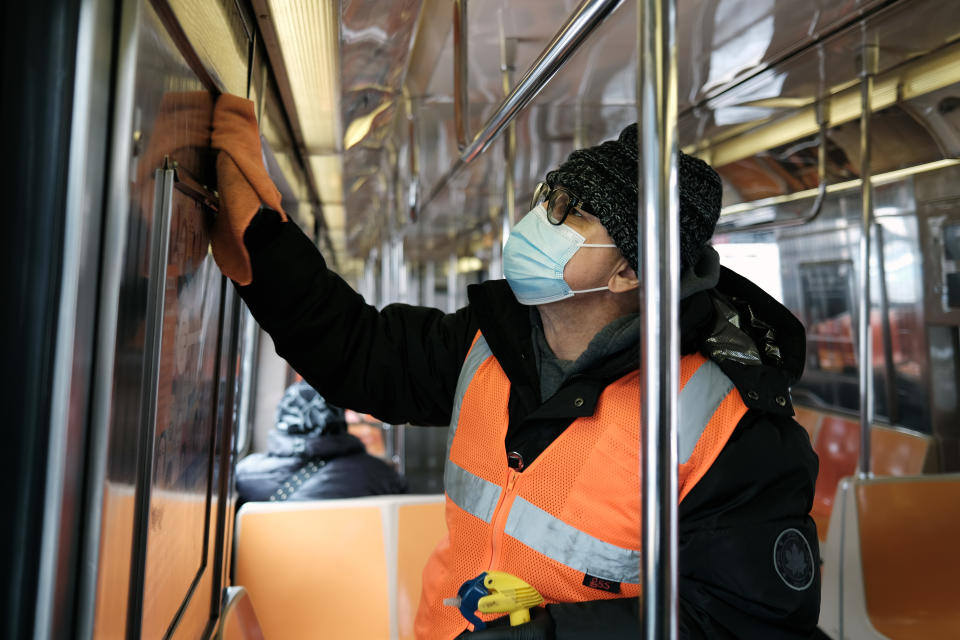 NEW YORK, NEW YORK - FEBRUARY 03: Subway cars are cleaned at Coney Island on February 03, 2021 in New York City. After a snow storm that left nearly two feet of snow over 48 hours, New Yorkers began to dig out and to go outside on Wednesday. The storm disrupted schools, transportation and Covid-19 vaccinations sites. (Photo by Spencer Platt/Getty Images)