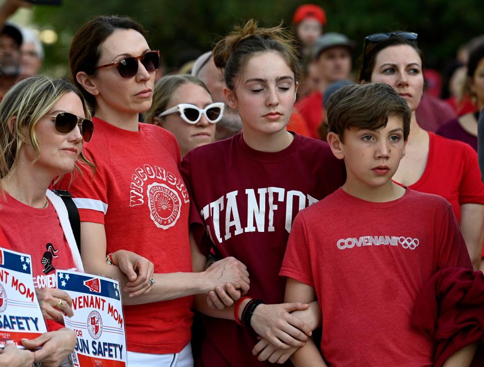 People pushing for gun safety and common-sense gun laws lock arms as they form a 3-mile human chain from the Monroe Carell Jr. Children’s Hospital at Vanderbilt to the Tennessee State Capitol on April 18 in Nashville. The human chain started at the hospital were the children shot in the Covenant School mass shooting were taken for care.