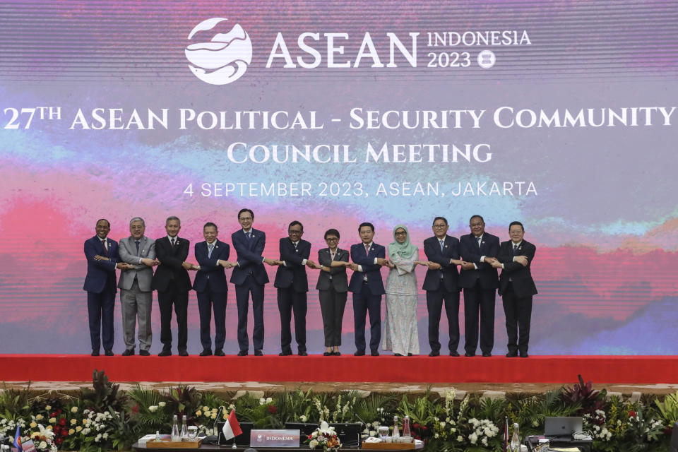From left to right, Malaysia's Foreign Minister Zambry Abd Kadir, Philippines' Foreign Secretary Enrique Manalo, Singapore's Foreign Minister Vivian Balakrishnan, Thailand's Permanent Secretary of the Ministry of Foreign Affairs Sarun Charoensuwan, Vietnam's Deputy Foreign Minister Do Hung Viet, Indonesia's Coordinating Minister for Political, Legal, and Security Affairs Mahfud MD, Indonesia's Foreign Minister Retno Marsudi, Laos' Foreign Minister Saleumxay Kommasith, Brunei's senior official Johariah Wahab, Cambodia's Foreign Minister Sok Chenda Sophea, East Timor's Foreign Minister Bendito dos Santos Freitas, and ASEAN Secretary General Kao Kim Hourn, hold hands during a family photo session during the 27th Association of Southeast Asian Nations (ASEAN) Political Security Community Council (APSC) Meeting ahead of the ASEAN Summit, at the ASEAN Secretariat in Jakarta, Indonesia, Monday, Sept. 4, 2023. (Mast Irham/Pool Photo via AP)