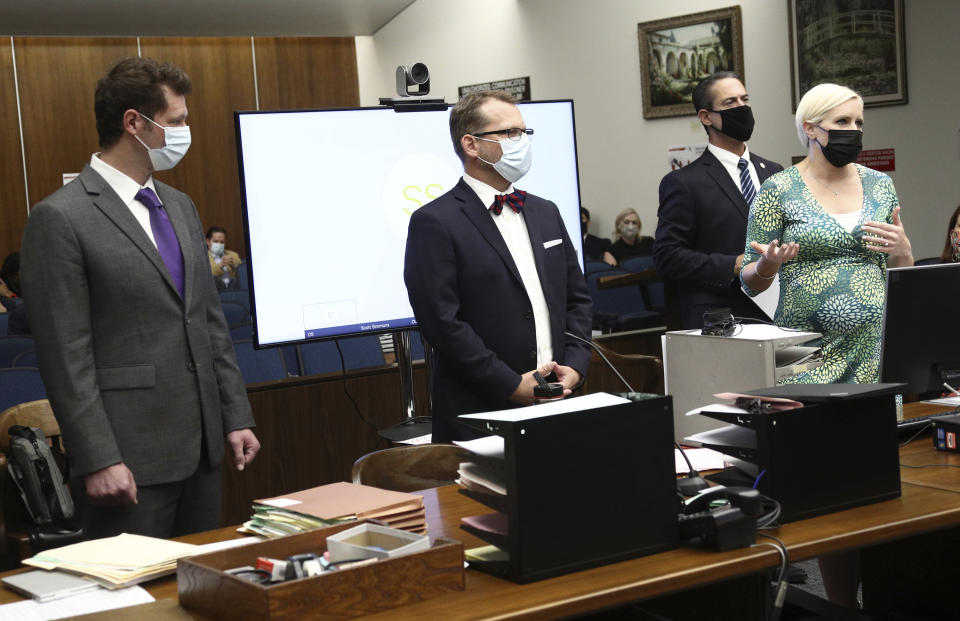 Deputy Alternate Defender Thomas Nocella, attorney Randy Bethune, Orange County District Attorney Todd Spitzer, and Senior Deputy District Attorney Whitney Bokosky, from left, address Orange County Superior Court Judge Larry Yellin during a hearing for Marcus Eriz and Wynne Lee at the Central Justice Center in Santa Ana, Calif., Friday, June 18 2021. Eriz, 24, and Lee, 23, both pleaded not guilty to the charges they face due to a road rage incident through their attorneys. (Frederick W. Brown/Pool via AP)