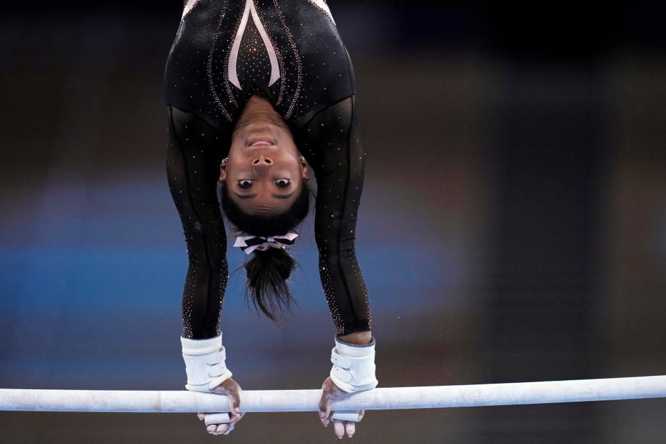 Simone Biles performs on uneven bars during podium training at the Ariake Gymnastics Center on Thursday, July 22, 2021, in Tokyo, Japan. 