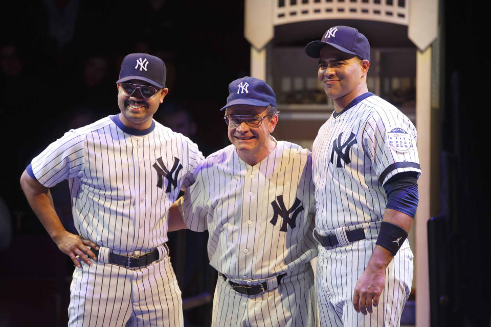 This image released by Polk & Co. shows Peter Scolari, portraying baseball legend Yogi Berra, center, and Francois Battiste, left, and Christopher Jackson in a scene from the play, "Bronx Bombers," which examines the rich history of the New York Yankees. (AP Photo/Polk & Co., Joan Marcus)