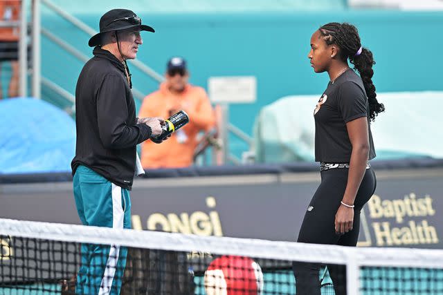 <p>Michele Eve Sandberg/Icon Sportswire via Getty</p> Coach Brad Gilbert speaks with Coco Gauff (USA) during practice during the Miami Open on March 19, 2024, at Hard Rock Stadium in Miami Gardens, FL.