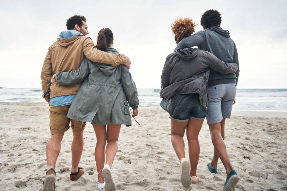 <p>Getty</p> stock image of two couples on vacation