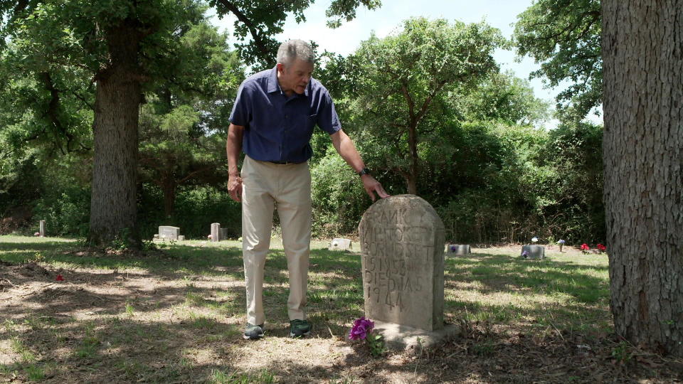 CBS News' Mark Whitaker at the grave of his great-grandfather, Frank Whitaker, who was enslaved from his birth in Texas in 1853 until the age of 11.   / Credit: CBS News